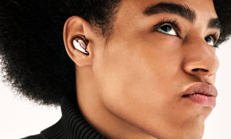 The Samsung Galaxy Buds Live are designed to sit within the ear's folds.