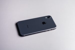 iPhone XR lying on a white table