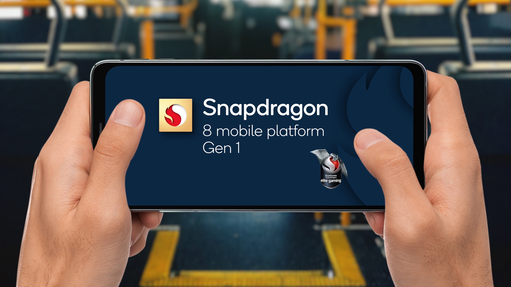 Snapdragon 8 Gen 1 logo on a phone held in two hands (like a gaming controller), by someone sitting on a bus